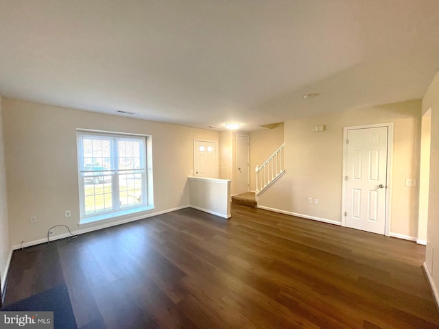 4522 Grouse Pl, Waldorf, MD 20603 - unfurnished living room with dark wood-style flooring, stairway, and baseboards