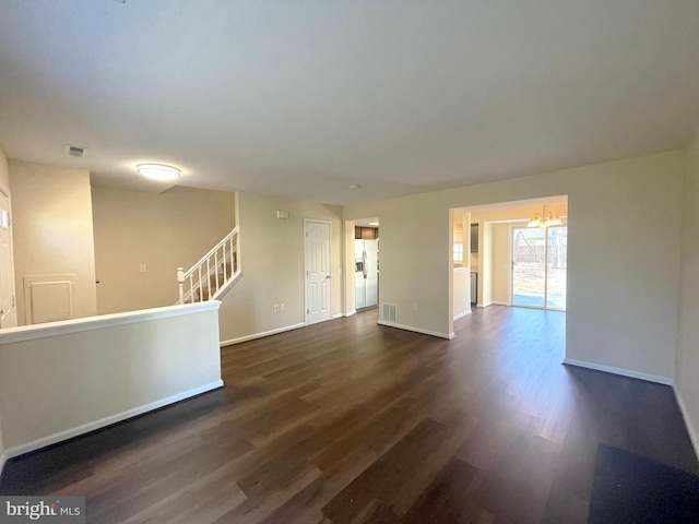 4522 Grouse Pl, Waldorf, MD 20603 - spare room with dark wood finished floors, a chandelier, and baseboards