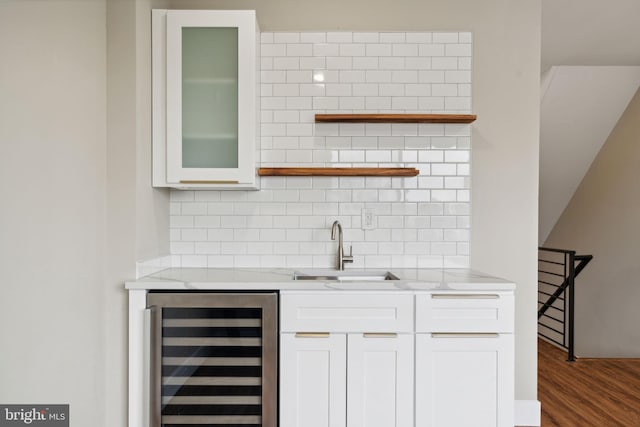 6210 Clearview St, Philadelphia, PA 19138 - indoor wet bar featuring beverage cooler, backsplash, and wood finished floors