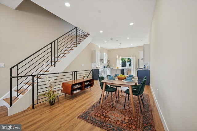 6210 Clearview St, Philadelphia, PA 19138 - dining space with light wood-style flooring, recessed lighting, baseboards, and stairway