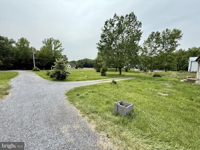 1170 Proctors Purchase Rd, Hartly, DE 19953 - view of home's community with a lawn and gravel driveway