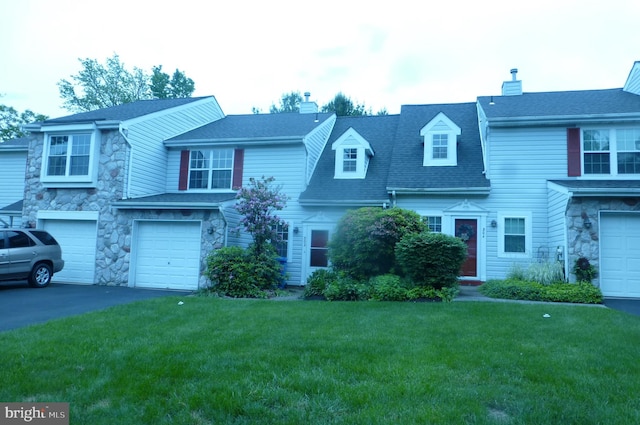 302 Independence Dr, Southampton, PA 18966 - view of front of house with stone siding, driveway, a garage, a front yard, and a shingled roof