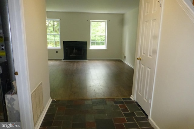 302 Independence Dr, Southampton, PA 18966 - unfurnished living room featuring a fireplace with raised hearth, baseboards, and dark wood finished floors