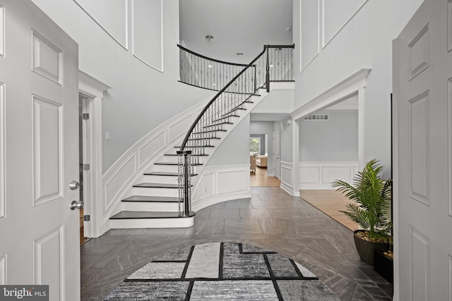 2 Jessica Ct, Tabernacle, NJ 08088 - entryway with stairway, a high ceiling, a decorative wall, and a wainscoted wall