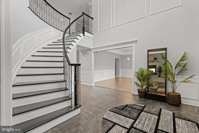 2 Jessica Ct, Tabernacle, NJ 08088 - stairway with a high ceiling, a decorative wall, and a wainscoted wall