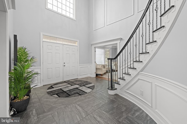 2 Jessica Ct, Tabernacle, NJ 08088 - entryway featuring a decorative wall, stairway, a wainscoted wall, and a towering ceiling