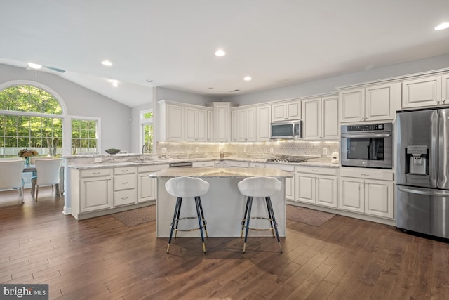 2 Jessica Ct, Tabernacle, NJ 08088 - kitchen with stainless steel appliances, a kitchen island, plenty of natural light, lofted ceiling, and backsplash