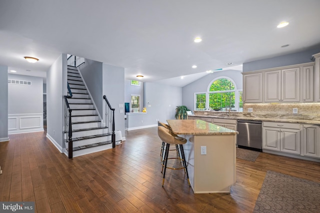 2 Jessica Ct, Tabernacle, NJ 08088 - kitchen featuring stainless steel dishwasher, a center island, a breakfast bar area, lofted ceiling, and dark wood finished floors