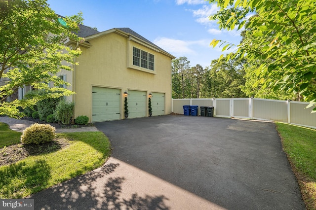 2 Jessica Ct, Tabernacle, NJ 08088 - view of side of property with stucco siding, driveway, and a garage