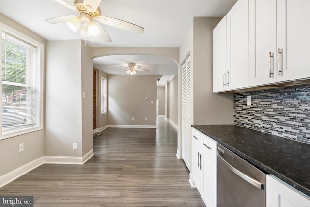 2808 Orleans St, Baltimore, MD 21224 - kitchen featuring stainless steel dishwasher, ceiling fan, arched walkways, tasteful backsplash, and light wood finished floors