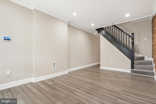 2808 Orleans St, Baltimore, MD 21224 - unfurnished living room with wood finished floors, baseboards, ornamental molding, stairs, and recessed lighting