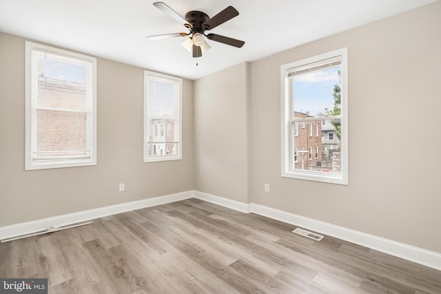 2808 Orleans St, Baltimore, MD 21224 - empty room with wood finished floors, ceiling fan, and healthy amount of natural light