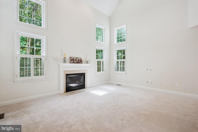 14908 Little Bennett Dr, Clarksburg, MD 20871 - unfurnished living room featuring high vaulted ceiling, carpet floors, a fireplace with flush hearth, and baseboards