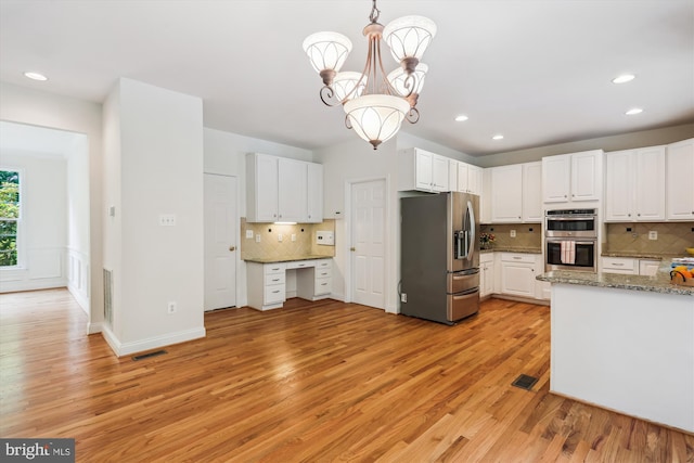 14908 Little Bennett Dr, Clarksburg, MD 20871 - kitchen featuring appliances with stainless steel finishes, light wood-style floors, backsplash, white cabinetry, and recessed lighting
