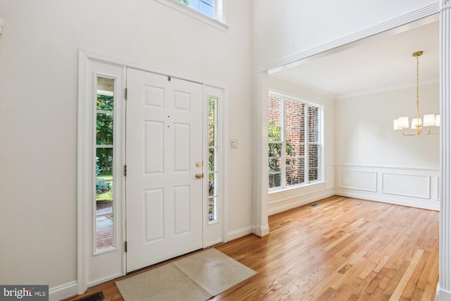 14908 Little Bennett Dr, Clarksburg, MD 20871 - foyer entrance with a chandelier, wood finished floors, and crown molding