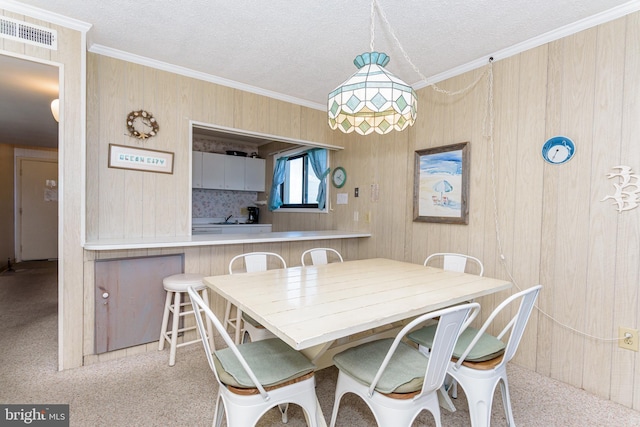 2901 Atlantic Ave Unit 404, Ocean City, MD 21842 - dining area with crown molding, carpet flooring, wooden walls, and a textured ceiling
