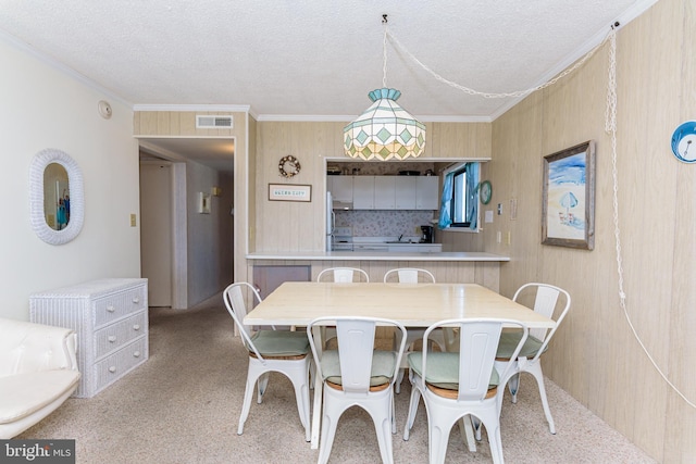 2901 Atlantic Ave Unit 404, Ocean City, MD 21842 - dining room featuring carpet flooring, crown molding, and a textured ceiling