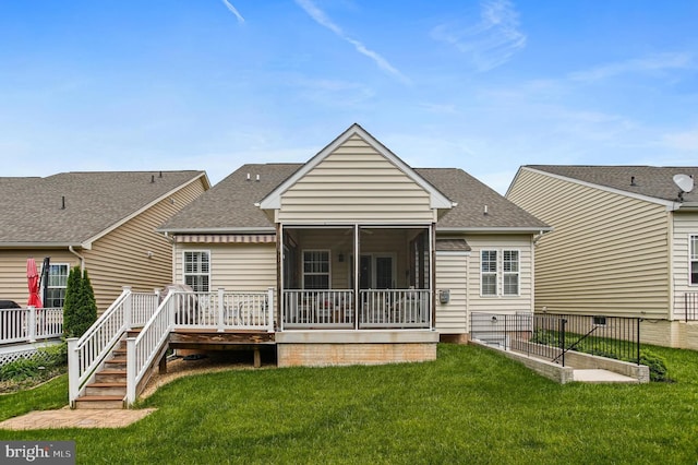 43 Triple Crown Dr Unit 441, Taneytown, MD 21787 - rear view of property featuring roof with shingles, a sunroom, a yard, and a deck