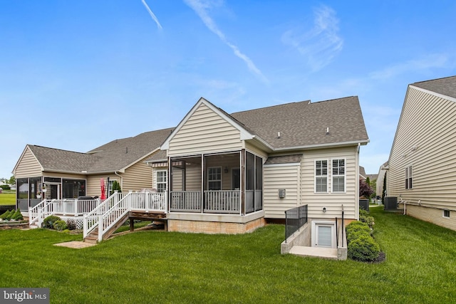 43 Triple Crown Dr Unit 441, Taneytown, MD 21787 - rear view of house featuring a sunroom, cooling unit, roof with shingles, and a lawn