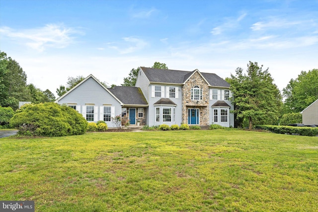124 Kirschling Dr, Woolwich Twp, NJ 08085 - view of front facade featuring a front lawn and stone siding