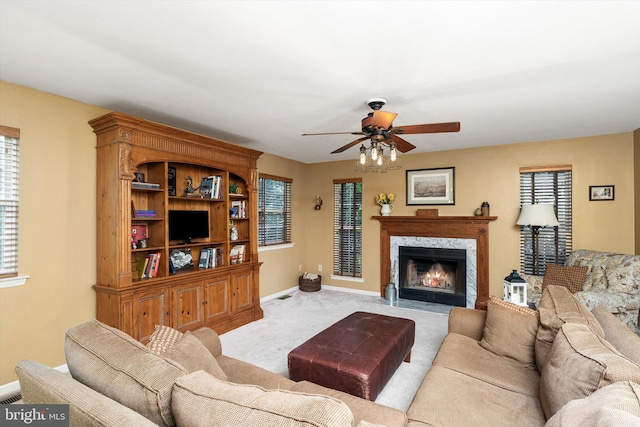 124 Kirschling Dr, Woolwich Twp, NJ 08085 - living area with ceiling fan, carpet, baseboards, and a high end fireplace