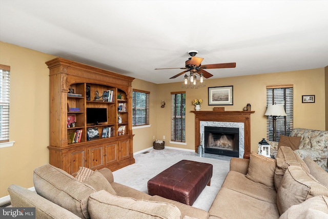 124 Kirschling Dr, Woolwich Twp, NJ 08085 - carpeted living room with a ceiling fan, baseboards, and a premium fireplace