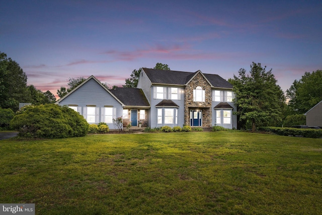 124 Kirschling Dr, Woolwich Twp, NJ 08085 - view of front facade featuring a yard and stone siding