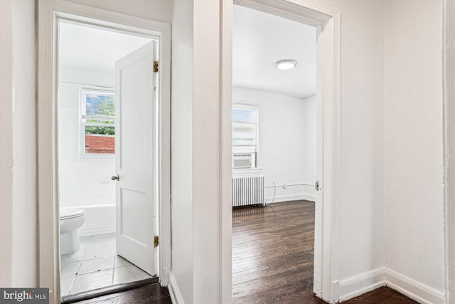 2425 E St NE, Washington, DC 20002 - corridor with radiator, wood finished floors, baseboards, and cooling unit