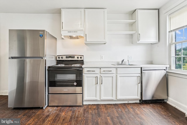 2425 E St NE, Washington, DC 20002 - kitchen with appliances with stainless steel finishes, under cabinet range hood, a sink, open shelves, and white cabinetry