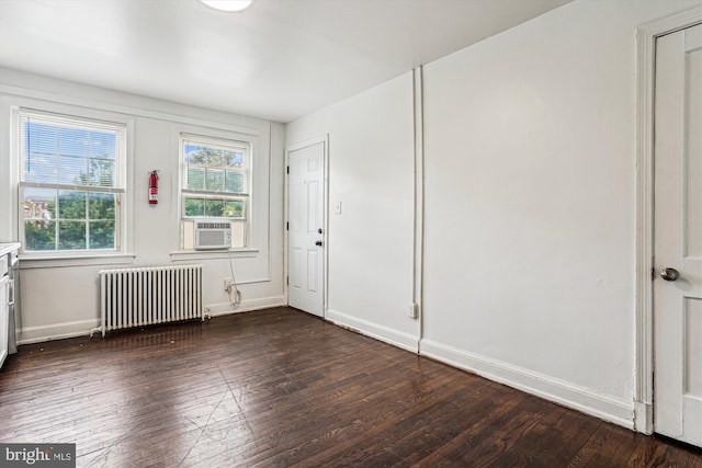 2425 E St NE, Washington, DC 20002 - entrance foyer with radiator, dark wood-type flooring, baseboards, and cooling unit