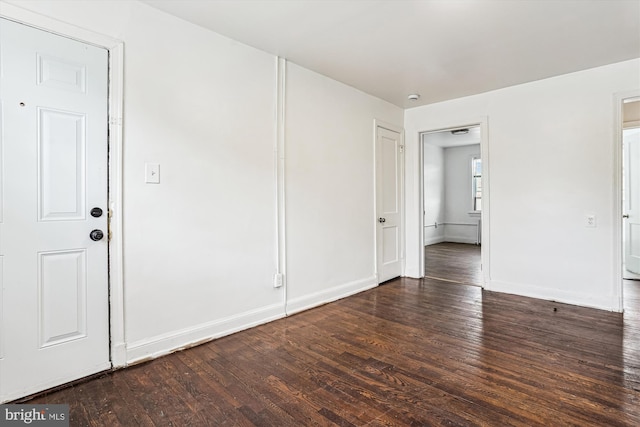 2425 E St NE, Washington, DC 20002 - empty room with dark wood-style floors and baseboards