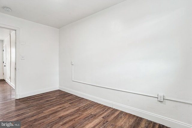 2425 E St NE, Washington, DC 20002 - spare room with a smoke detector, dark wood-type flooring, and baseboards