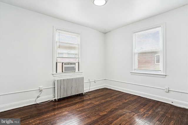 2425 E St NE, Washington, DC 20002 - empty room featuring radiator, hardwood / wood-style flooring, and baseboards
