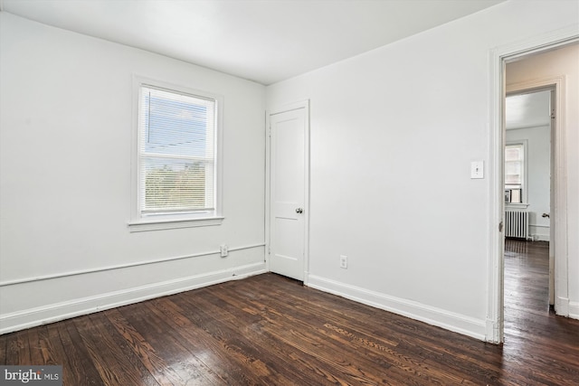 2425 E St NE, Washington, DC 20002 - spare room with dark wood-style flooring, radiator, and baseboards