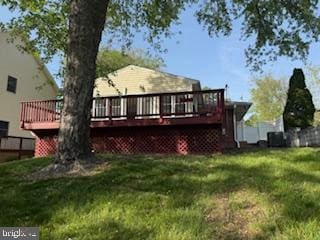 7686 Briar Ln, Pasadena, MD 21122 - back of property with a lawn and a deck