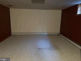 7686 Briar Ln, Pasadena, MD 21122 - spare room with a paneled ceiling and baseboards