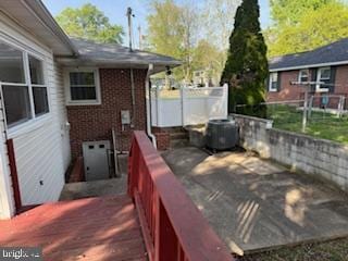 7686 Briar Ln, Pasadena, MD 21122 - wooden deck with central air condition unit