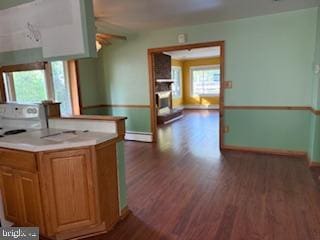 7686 Briar Ln, Pasadena, MD 21122 - kitchen with baseboards, dark wood-style flooring, ceiling fan, and baseboard heating