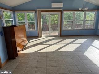 7686 Briar Ln, Pasadena, MD 21122 - unfurnished sunroom with vaulted ceiling, healthy amount of natural light, a wall mounted air conditioner, and tile patterned floors