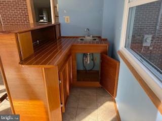 7686 Briar Ln, Pasadena, MD 21122 - bar area with light tile patterned flooring