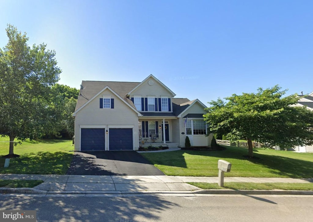 212 Chieftan Ln, Boonsboro, MD 21713 - traditional home with driveway, a front yard, and an attached garage