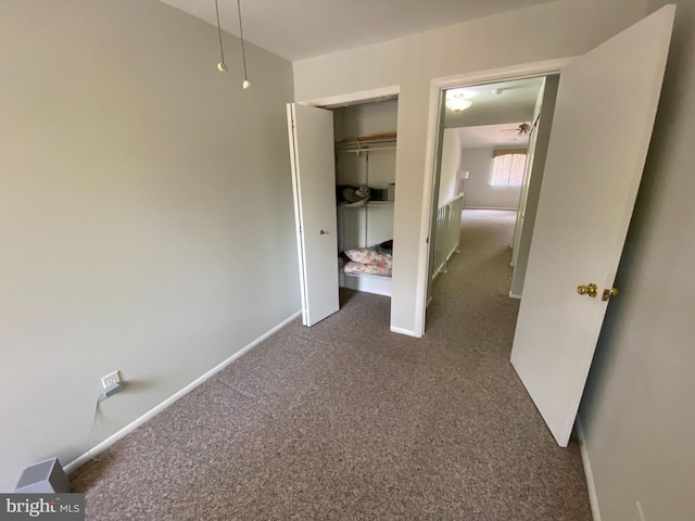 402 Cypress Point Cir, Mount Laurel, NJ 08054 - unfurnished bedroom featuring dark carpet, baseboards, and a closet