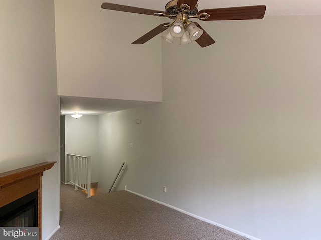 402 Cypress Point Cir, Mount Laurel, NJ 08054 - unfurnished living room with carpet, a ceiling fan, a glass covered fireplace, and baseboards