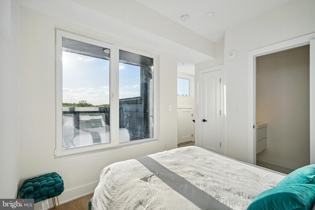 1307 Longfellow St NW Unit 10B, Washington, DC 20011 - bedroom featuring baseboards and wood finished floors