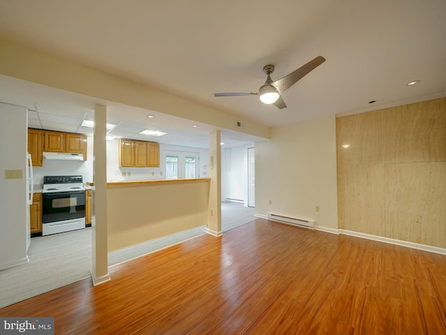 9407 7th St N, Laurel, MD 20723 - unfurnished living room with baseboard heating, light wood-style flooring, ceiling fan, a baseboard radiator, and baseboards