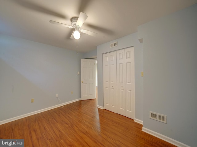 9407 7th St N, Laurel, MD 20723 - unfurnished bedroom with wood finished floors, baseboards, a closet, and ceiling fan