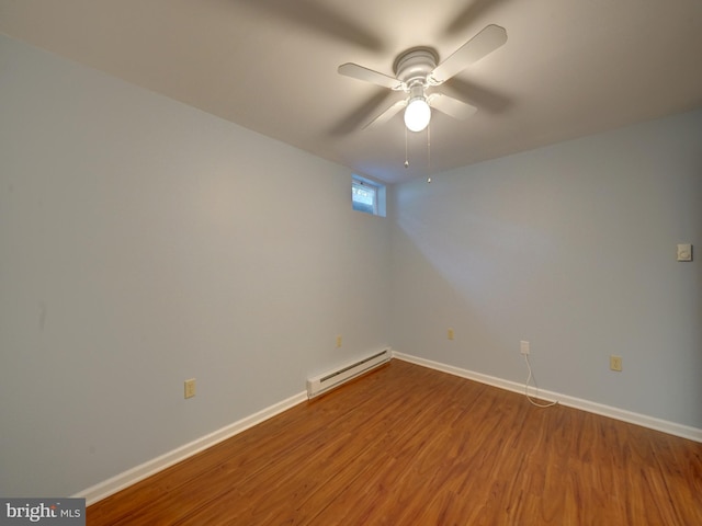 9407 7th St N, Laurel, MD 20723 - spare room featuring a baseboard radiator, wood finished floors, baseboards, and ceiling fan