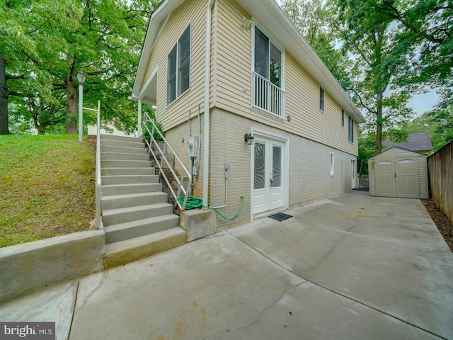 9407 7th St N, Laurel, MD 20723 - back of property featuring french doors, brick siding, stairway, and a patio area