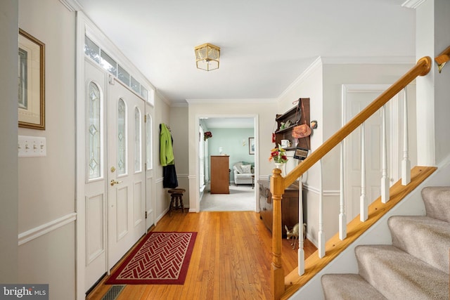 14 Baron Ct, Stafford, VA 22554 - foyer entrance featuring stairs, light wood-style floors, healthy amount of natural light, and crown molding