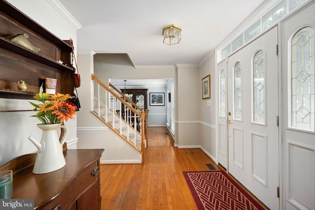 14 Baron Ct, Stafford, VA 22554 - foyer entrance with stairs, light wood finished floors, baseboards, and crown molding